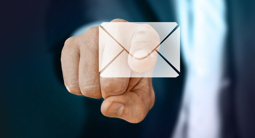 man pressing email icon on screen